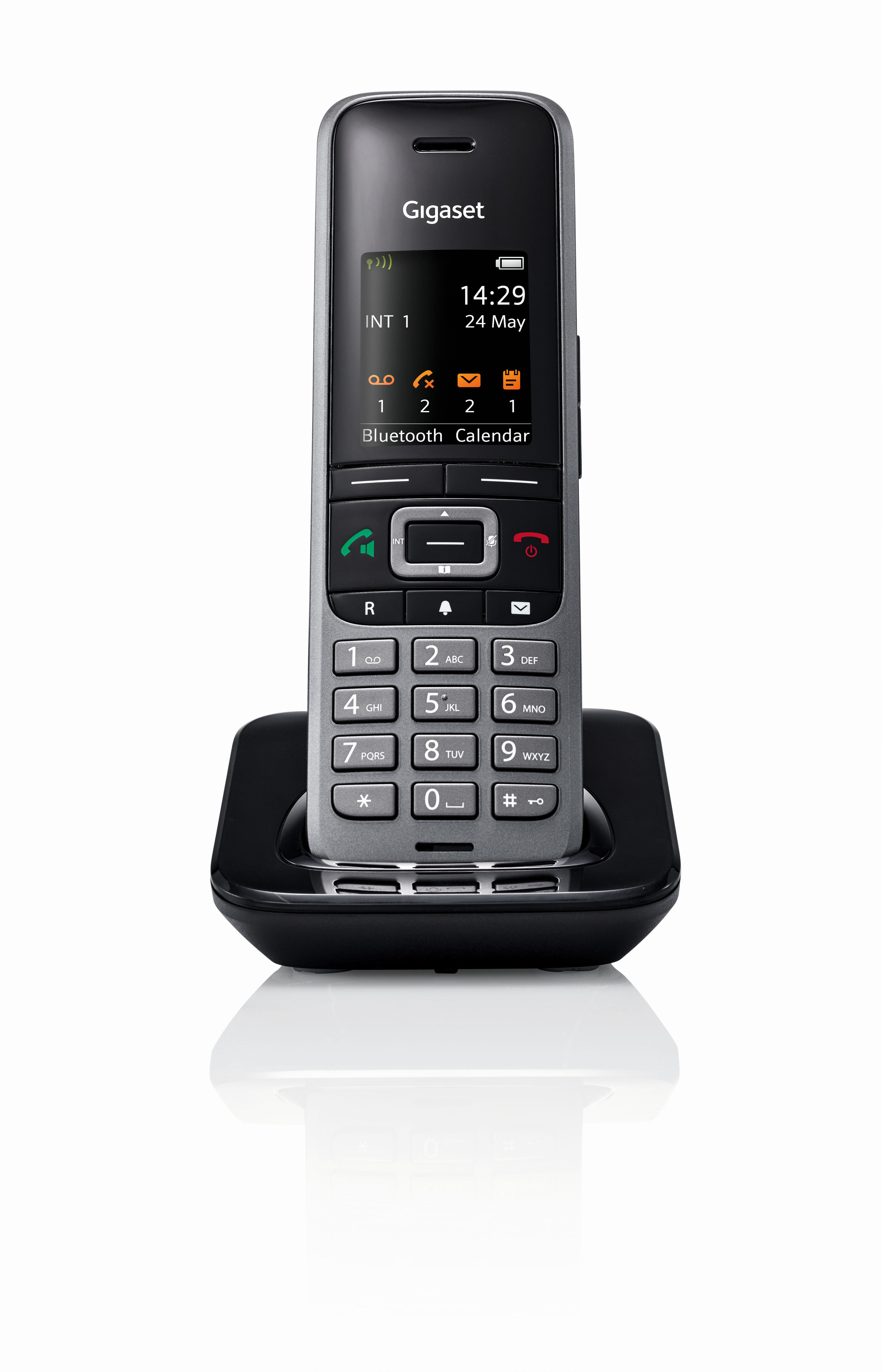 Ein schwarz-graues Gigaset-Telefon auf seiner Basis.