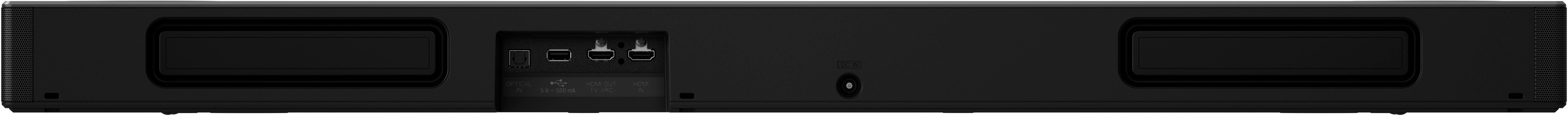 Eine schwarze Soundbar mit Anschlüssen und einem Ein-/Ausschalter liegt auf einer weißen Oberfläche.