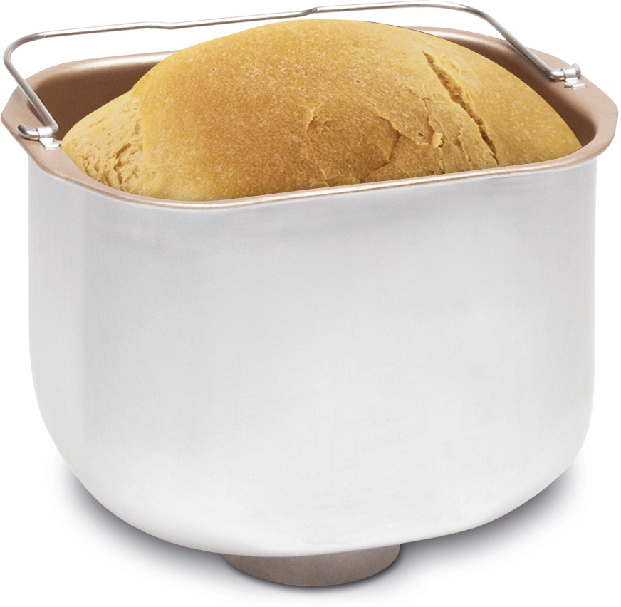 Una pagnotta dorata in una teglia bianca per pane con manici.