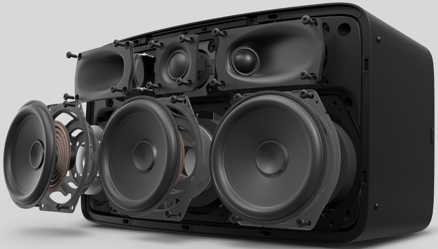An exploded view of a black soundbar speaker, revealing internal components.