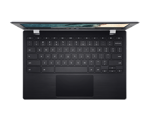 Vista aérea de un portátil abierto con teclado y panel táctil negros. La pantalla muestra un color claro.