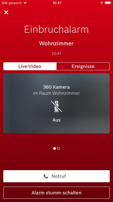 Ein Smartphone-Bildschirm zeigt einen roten Hintergrund mit Alarminformationen und Schaltflächen in einer rot-weißen Oberfläche.