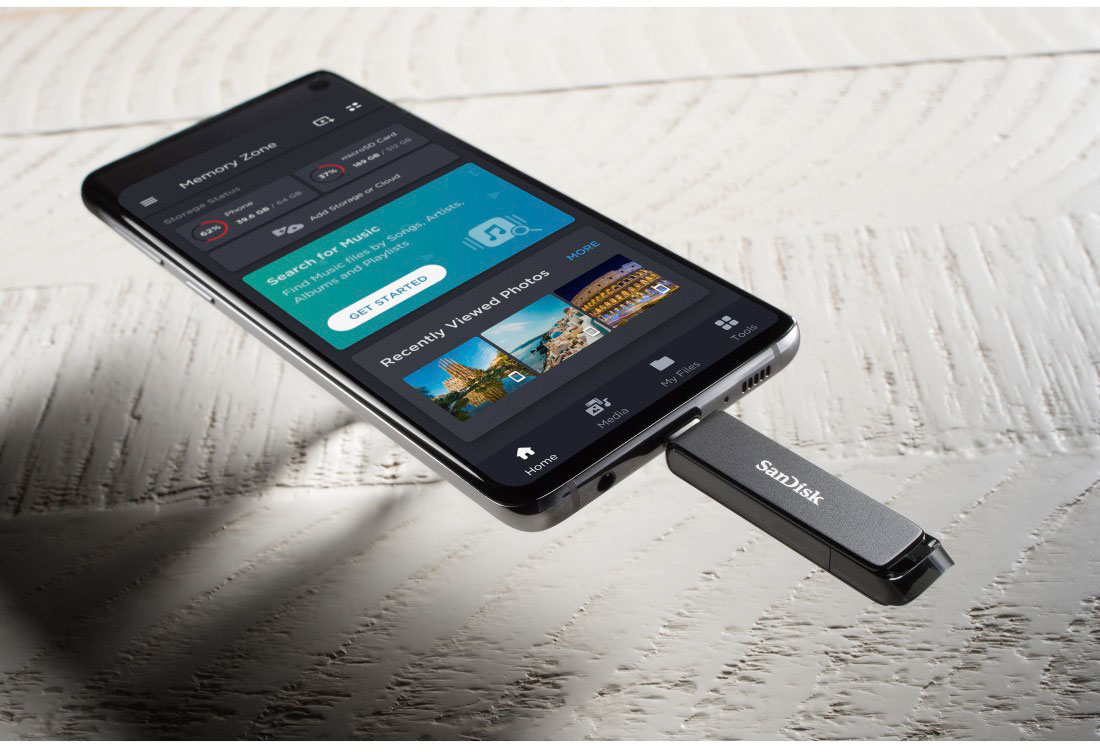 Black smartphone with a USB drive plugged in, displaying storage information.