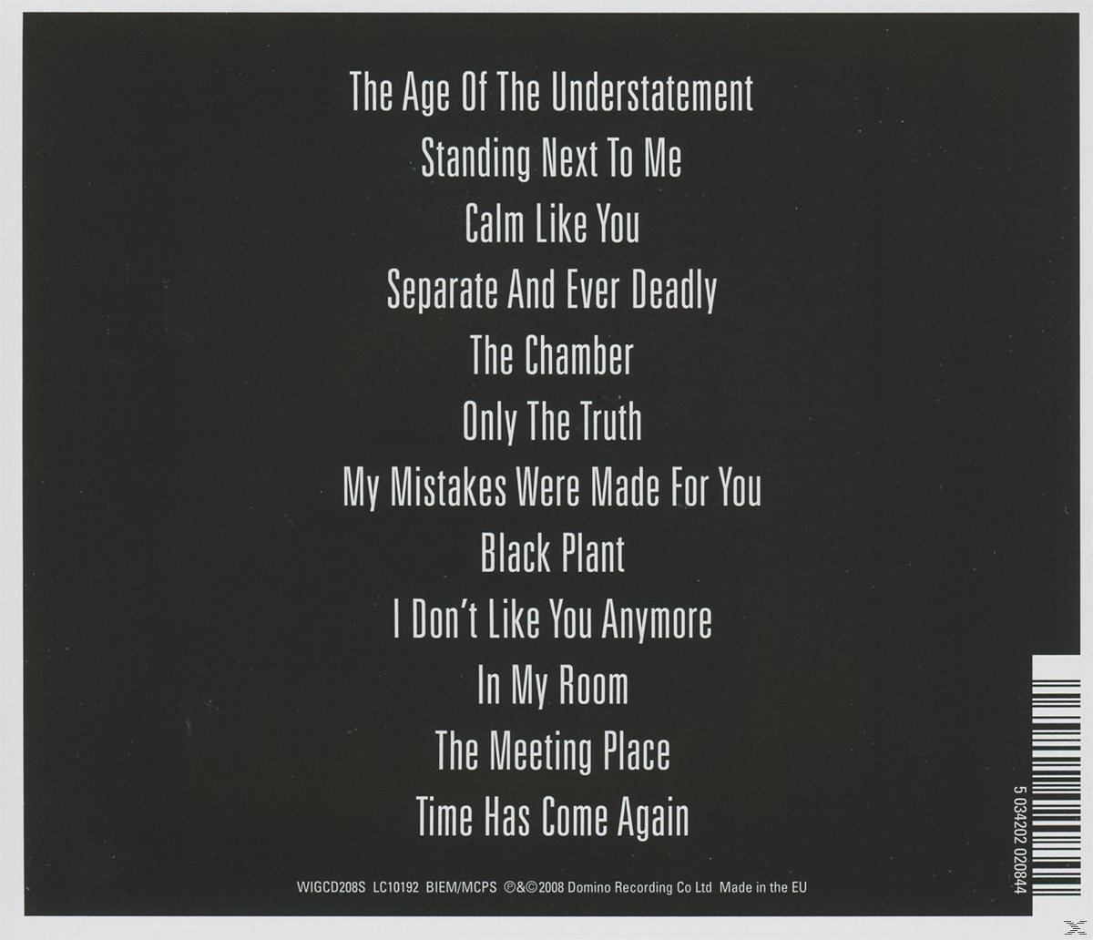 Rückseite eines Albums mit Songtiteln in Weiß auf schwarzem Hintergrund.