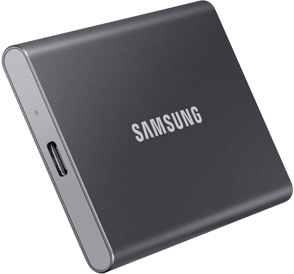 A dark grey Samsung external SSD is shown, with the brand name prominently displayed.