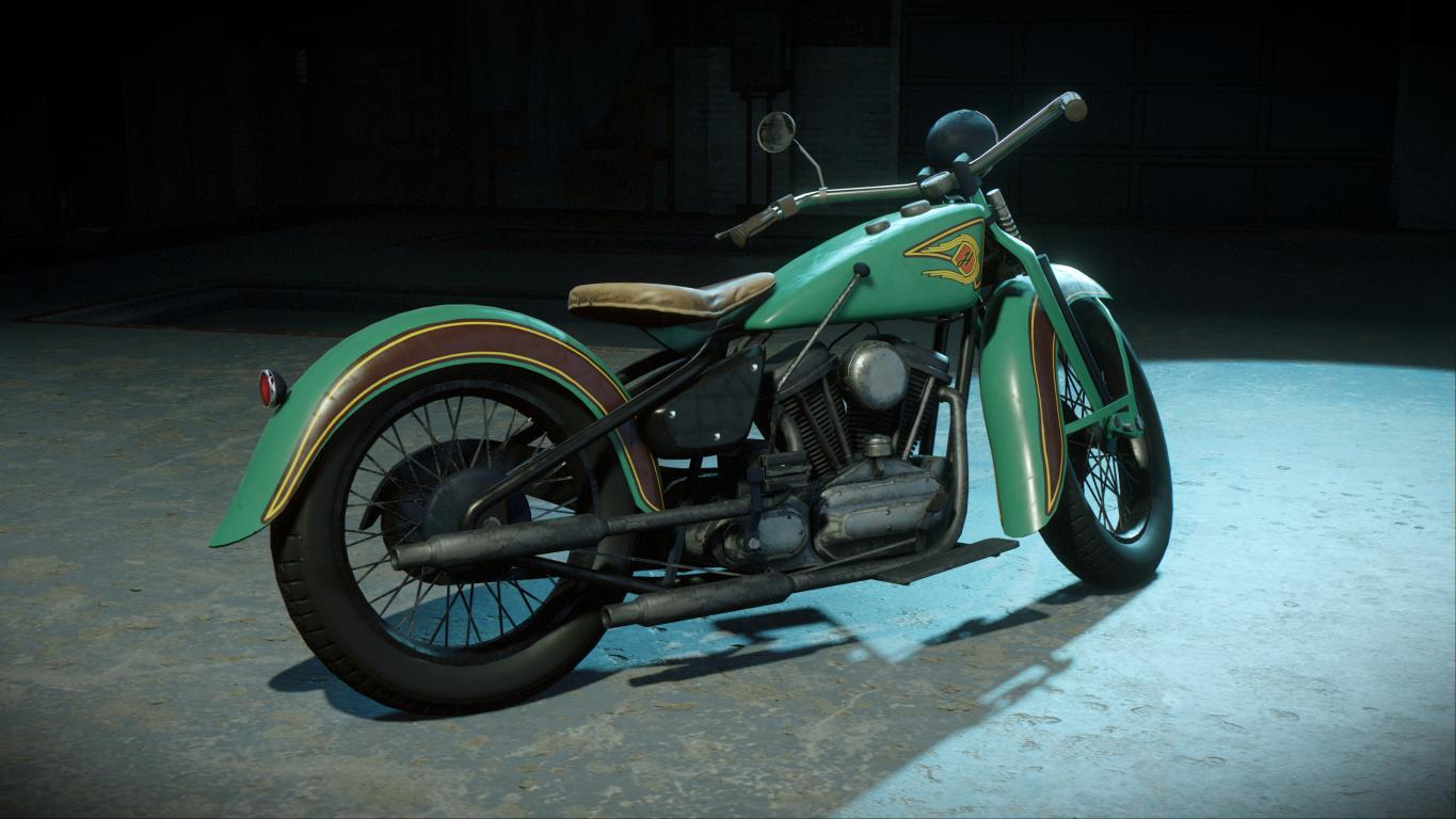 Motocicleta verde y marrón vintage en un garaje oscuro, vista en ángulo.
