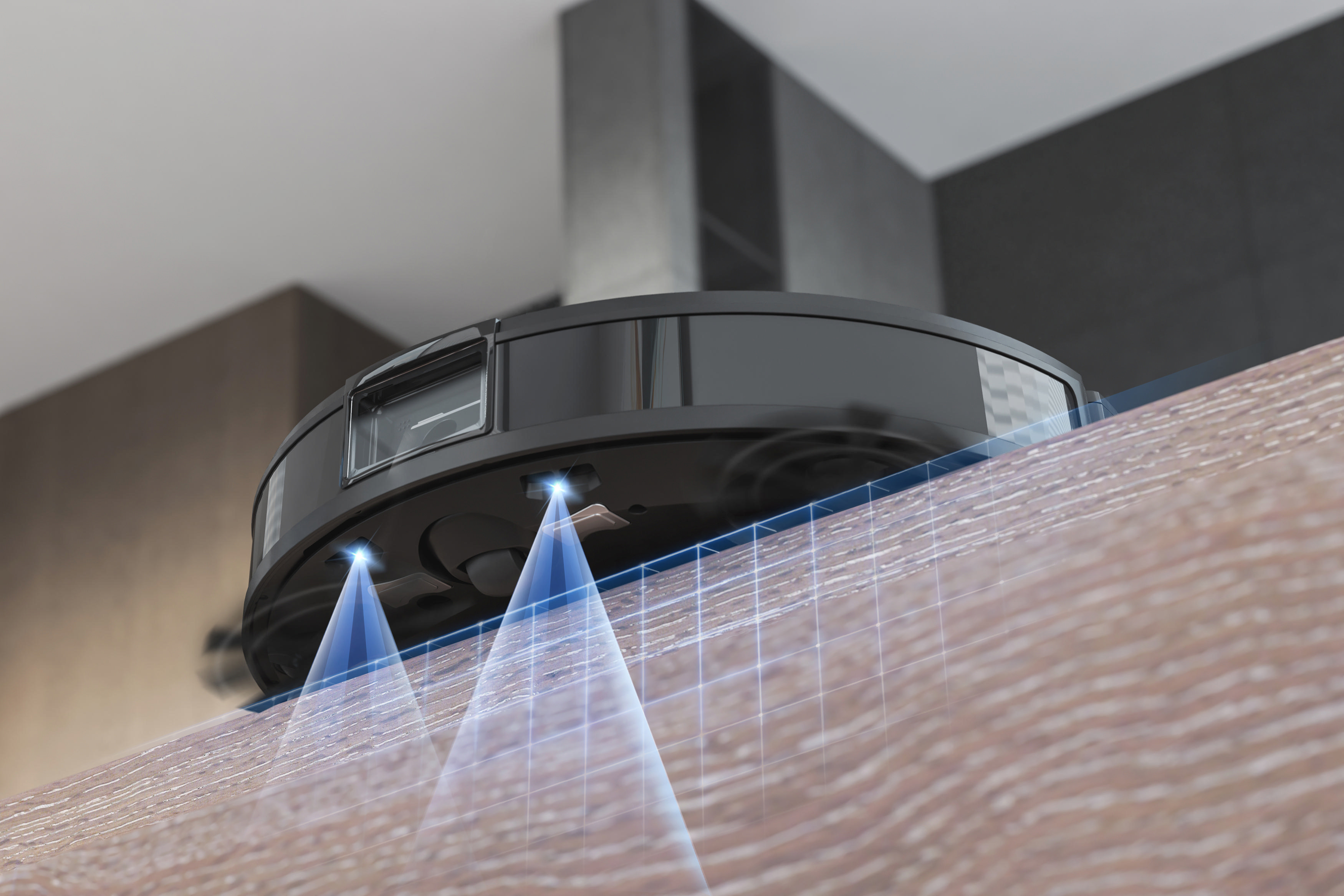 Nahaufnahme eines Roboter-Staubsaugers, der blaue Lichtstrahlen und Holzoberfläche zeigt.