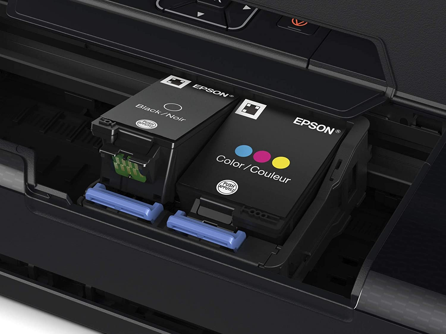 Primer plano de los cartuchos de tinta de una impresora Epson, negro y color.