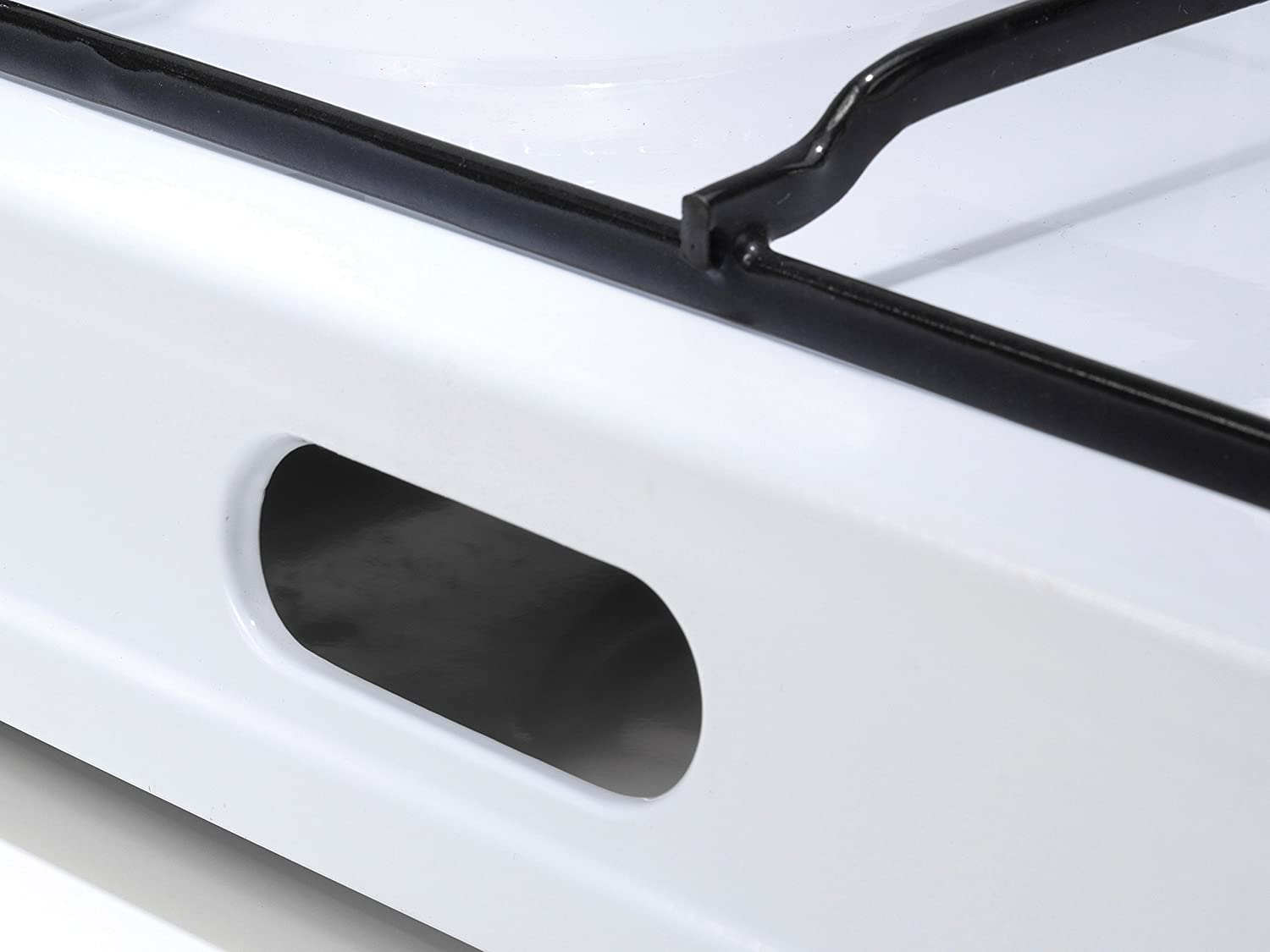 White stove component with an opening. A close-up view.