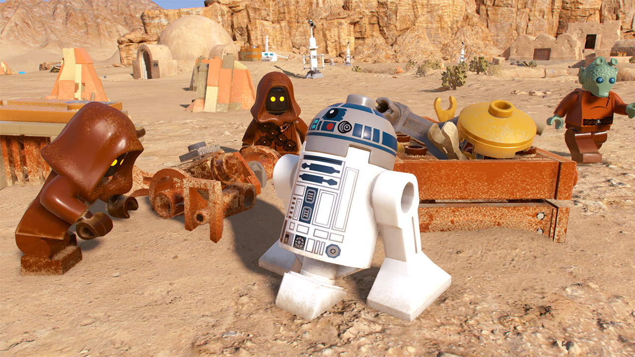 Scène LEGO avec Jawas, R2-D2 et d'autres personnages dans un décor désertique. Couleurs marron et beige.
