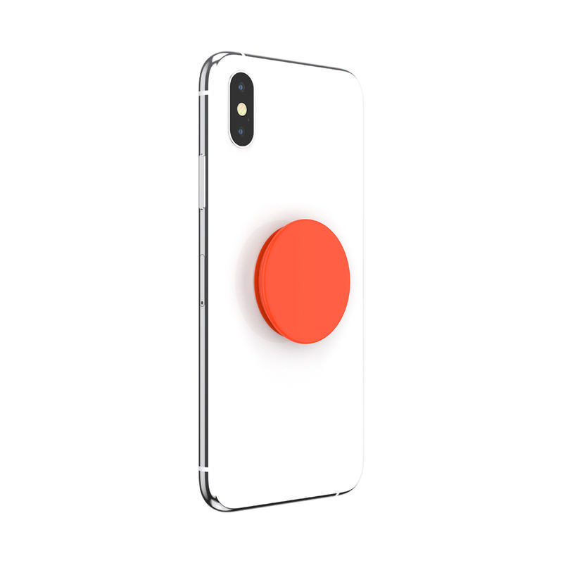 Ein weißes Telefon mit einem roten, kreisförmigen Pop-Socket auf der Rückseite.
