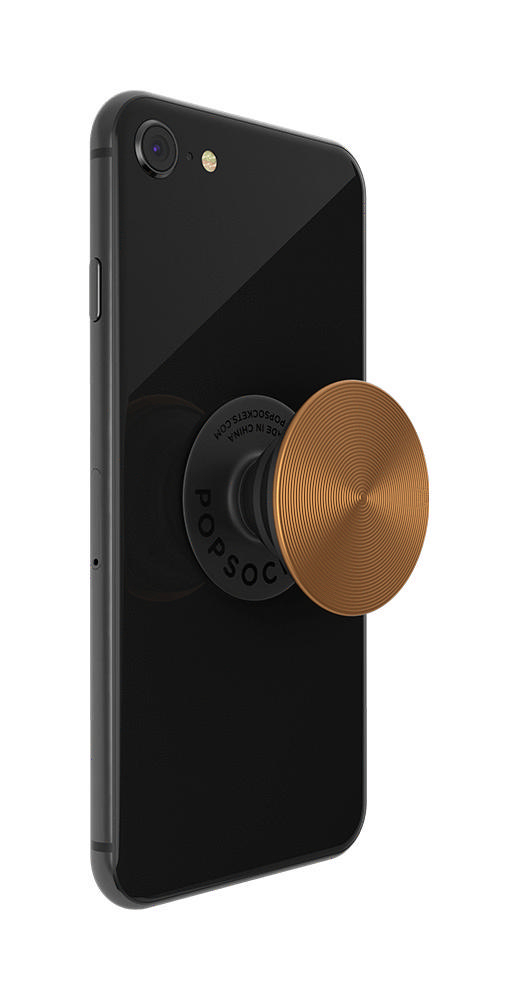 Schwarzes Telefon mit kupferfarbenem PopSocket auf der Rückseite.
