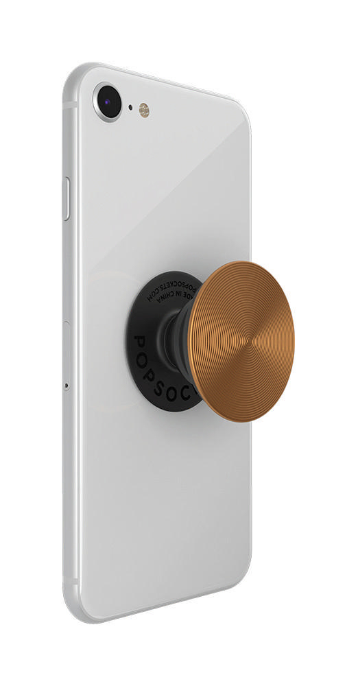 Ein weißes iPhone mit einem goldenen Popsocket. Der Popsocket ist schwarz mit goldenem Kreisdesign.
