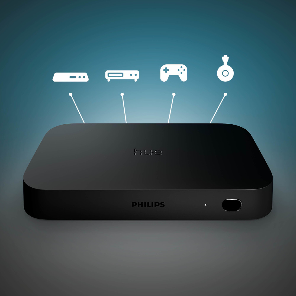 Een zwarte Philips Hue smart home hub, met pictogrammen van aangesloten apparaten en het Philips logo.