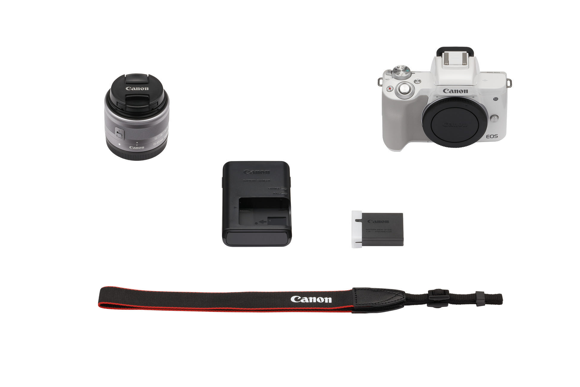 Canon Kamera-Kit mit Kamera, Objektiv, Ladegerät, Akku und Gurt. Alle Komponenten auf weißer Oberfläche.