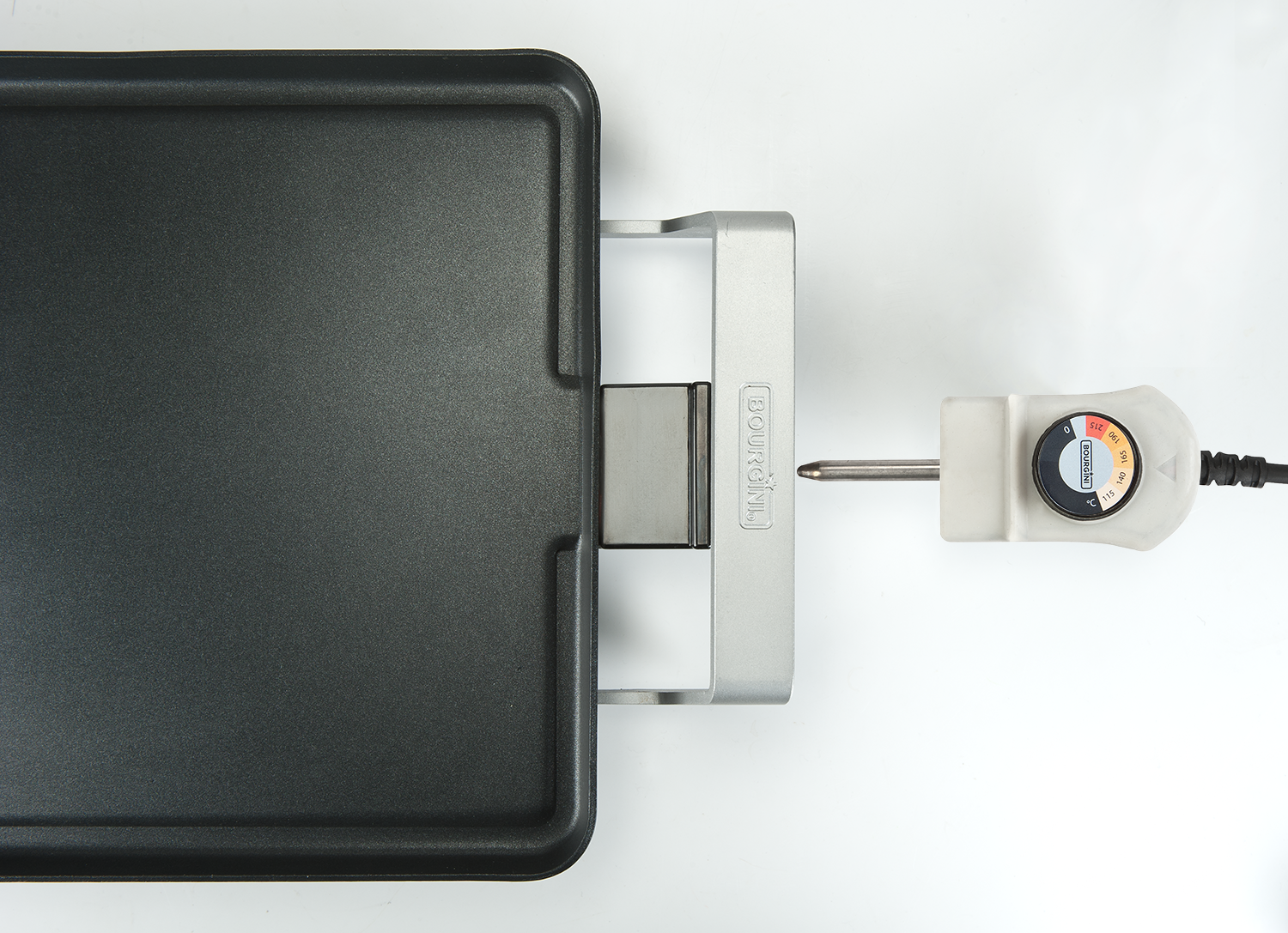 A black electric griddle with a silver handle and a temperature control dial.