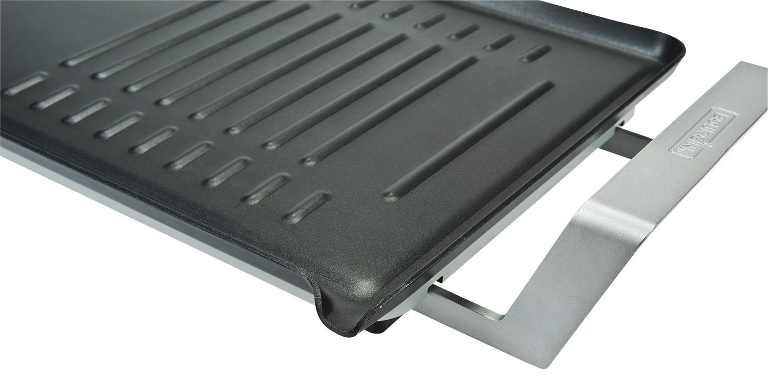 Grill plate with a non-stick surface. A metal support is attached on the right.