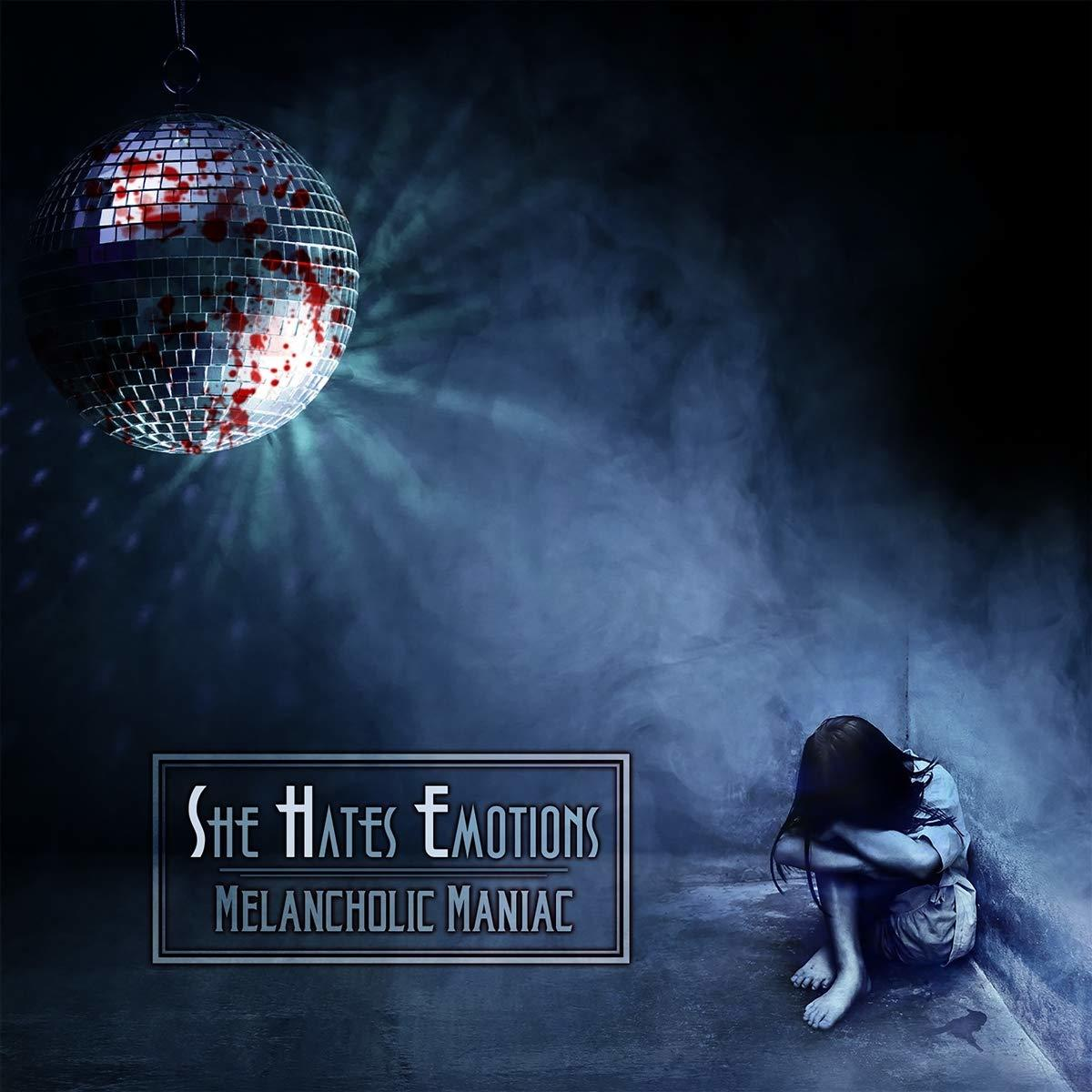 'She Hates Emotions' album borítója, egy személyel egy disco labda mellett.