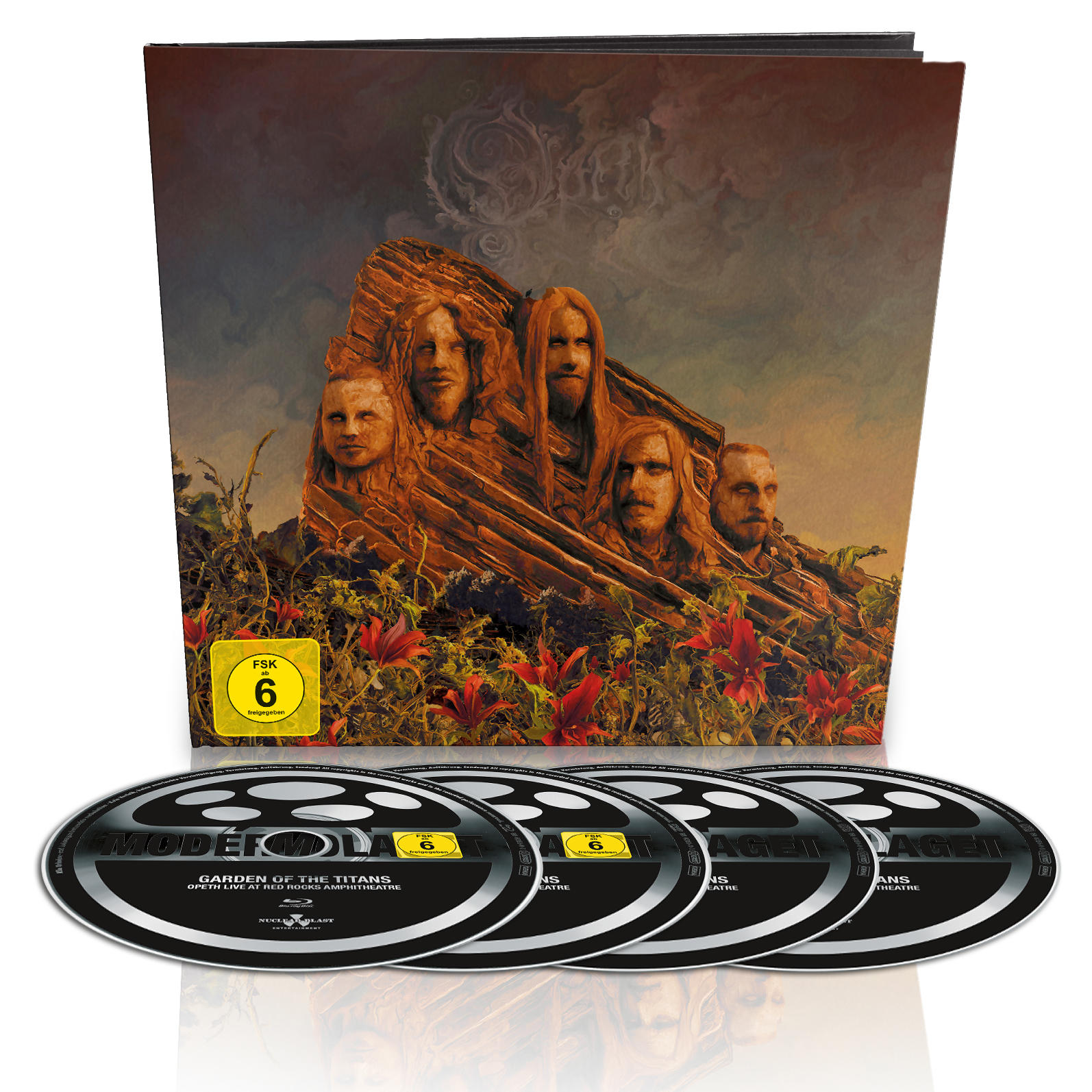 Album borító faragott arcokkal. Négy CD alatta. Az album borítója egy hegybe faragott zenekari tagokat ábrázol.
