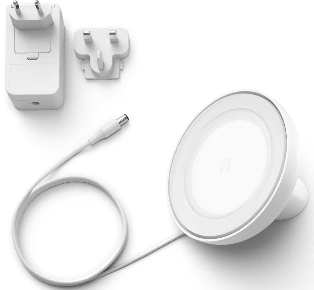 White device with a button and vents, close-up.