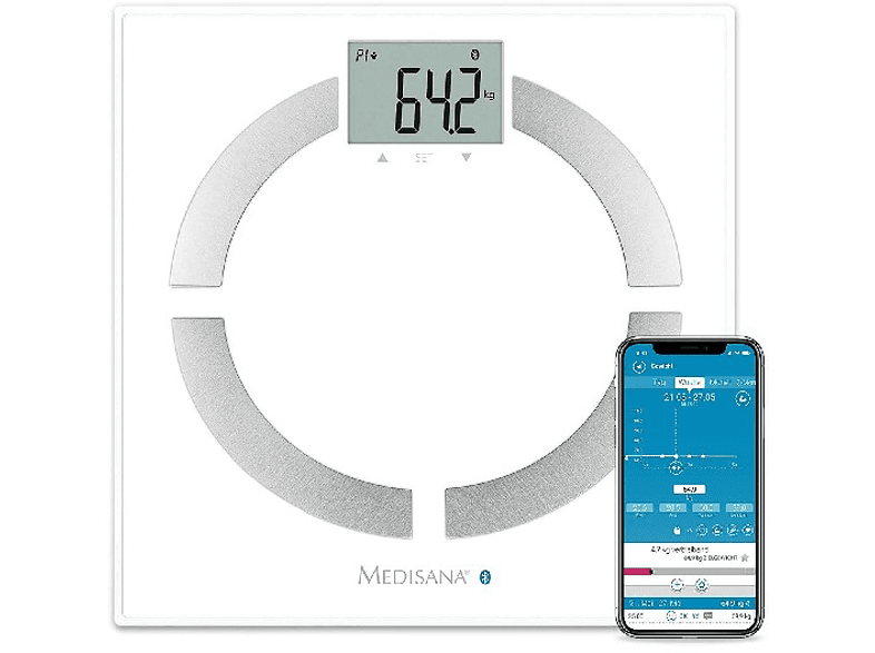 Una báscula digital blanca que muestra 64,2 kg y un smartphone con una app.