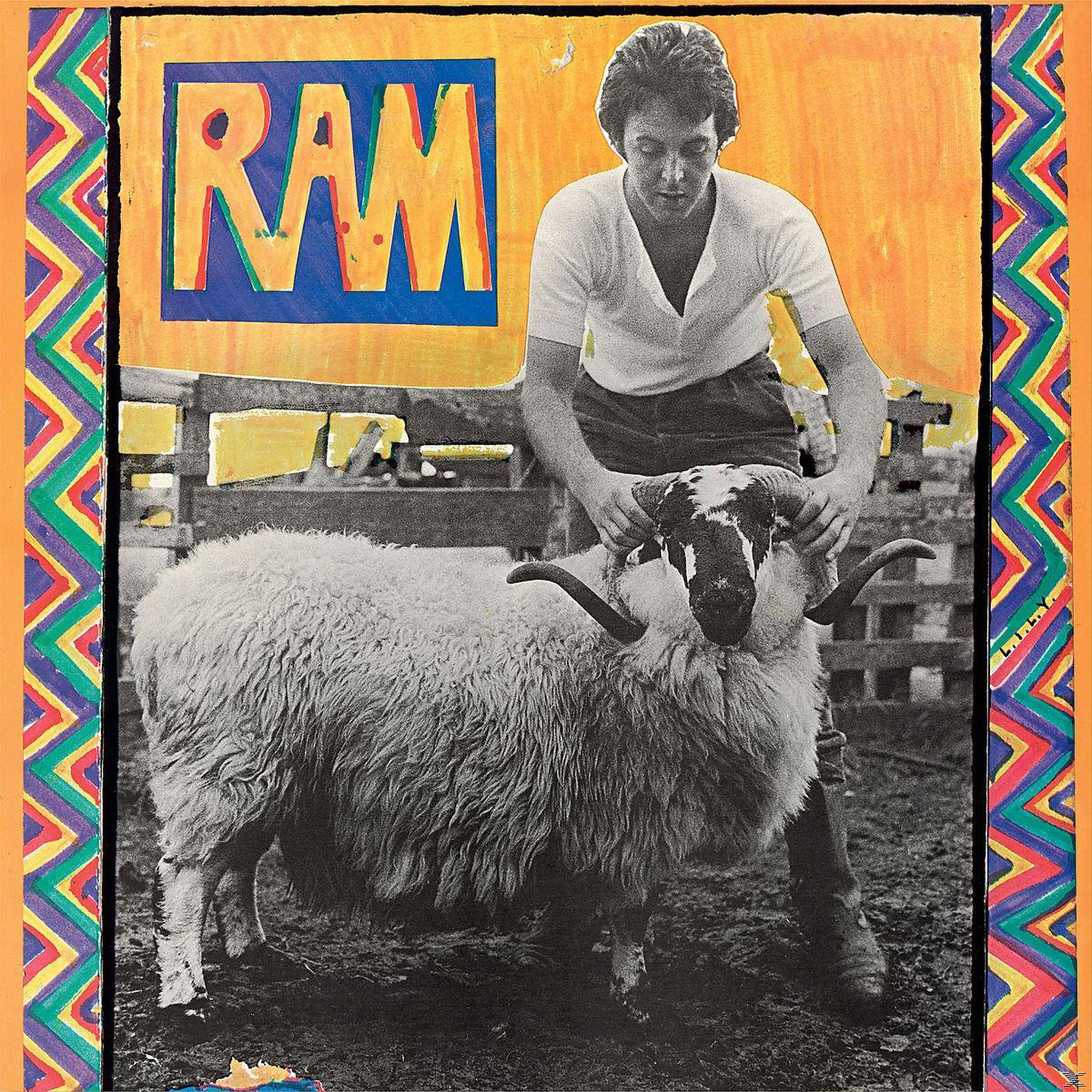 Albumcover, Mann hält einen Widder, gelb-blauer Text "RAM", bunter Rahmen.