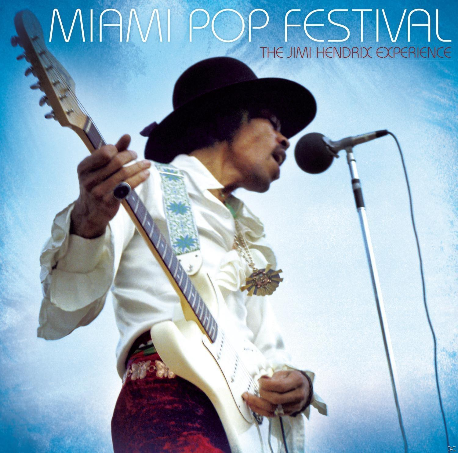 Jimi Hendrix a színpadon gitározik, 'Miami Pop Festival' felirattal.