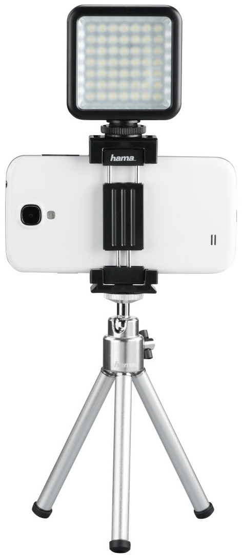 Smartphone attached to a tripod with a video light on top, all set up for filming.