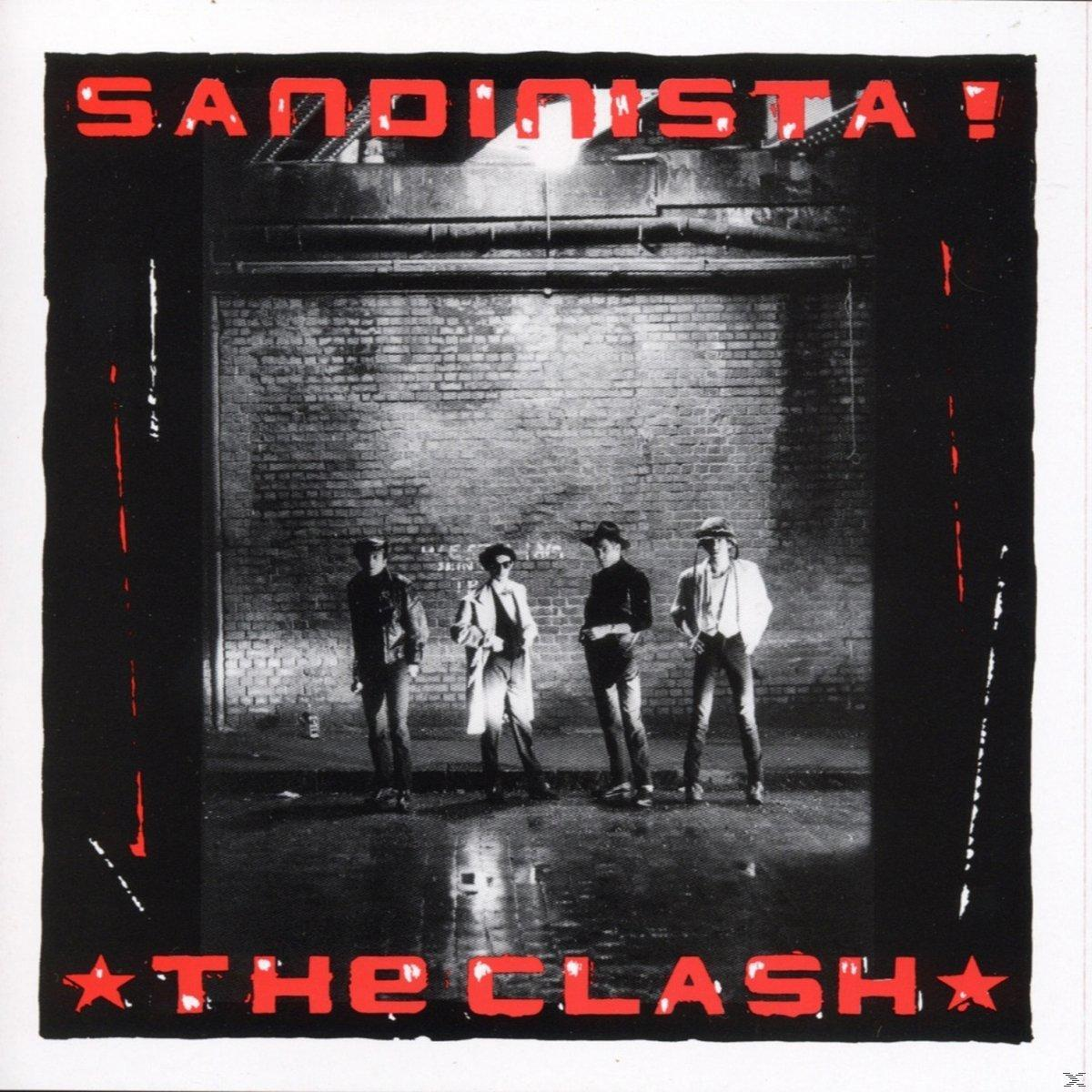 Album borító négy zenekar taggal, téglafal előtt állva, a 'Sandinista!' címmel, The Clash.