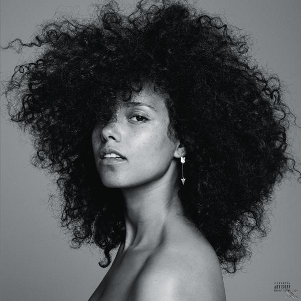 Fekete-fehér fotó Alicia Keys-ről, nagy göndör hajjal, a kamerába néz. Nyíl fülbevaló.
