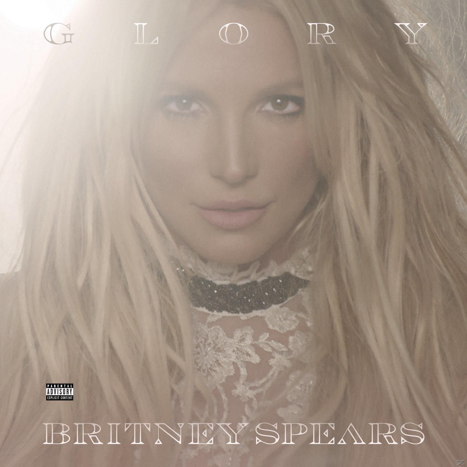 Album borító Britney Spears arcával, a 'Glory' címmel felül. Hosszú szőke haja és fekete nyaklánca van.