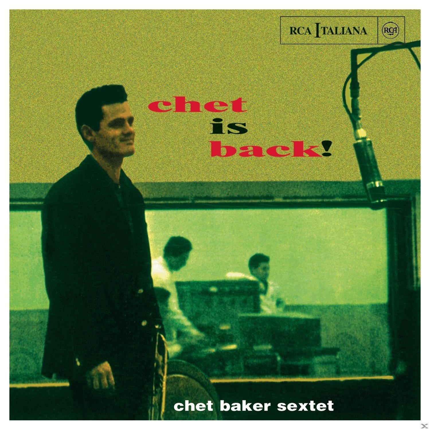 Albumcover mit einem Mann im Anzug, einem Mikrofon und einer Band im Hintergrund.