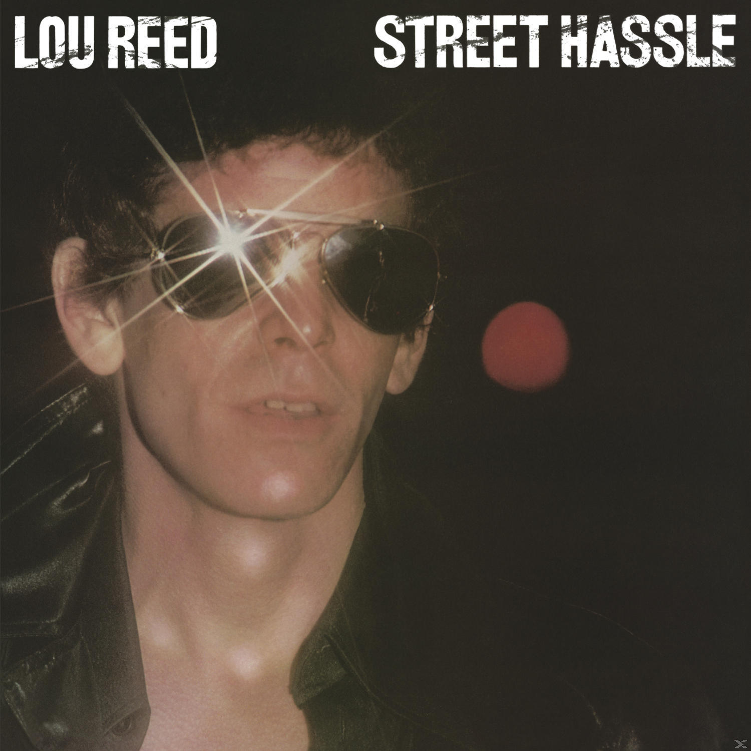 Album borító: Lou Reed napszemüvegben. Szöveg: Street Hassle.