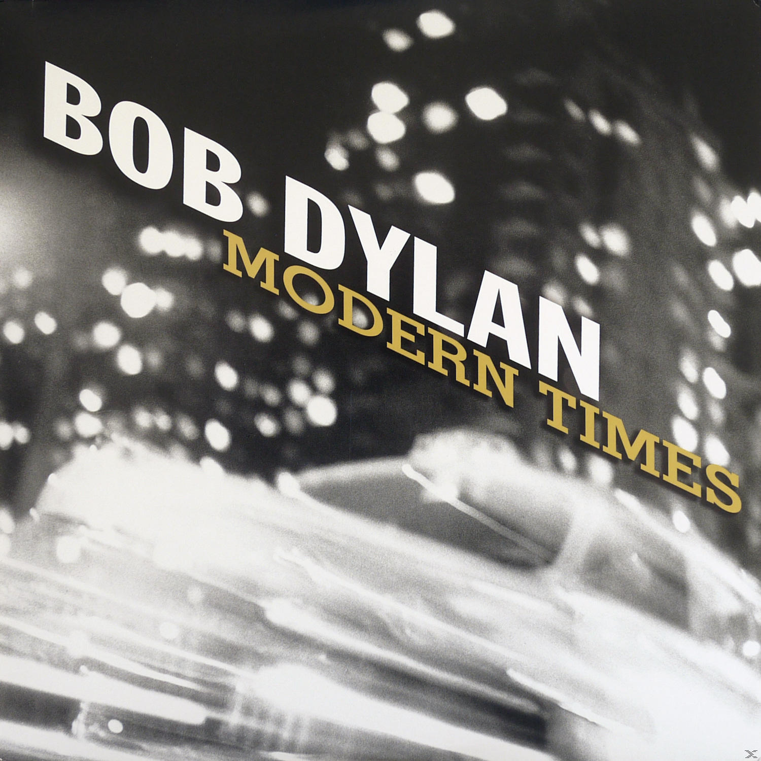 Albumcover, Bob Dylan, Text 'Modern Times', verschwommener Hintergrund, Schwarzweiß.