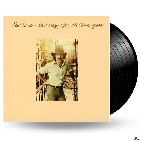 Paul Simon album borítója szöveggel, bézs háttérrel.