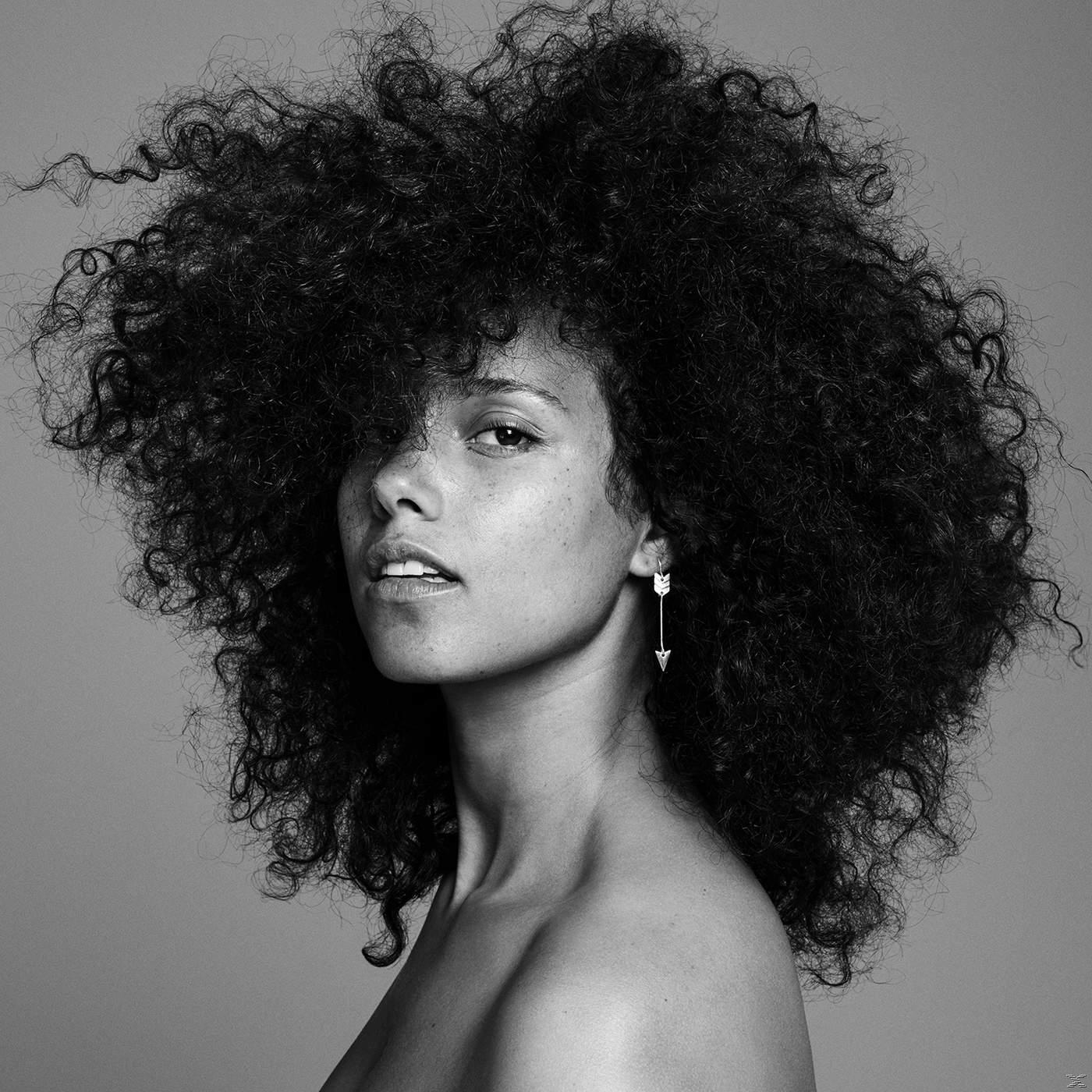 Alicia Keys Albumcover. Frau mit großem Afro und Pfeil-Ohrring. Schwarz-Weiß-Bild.