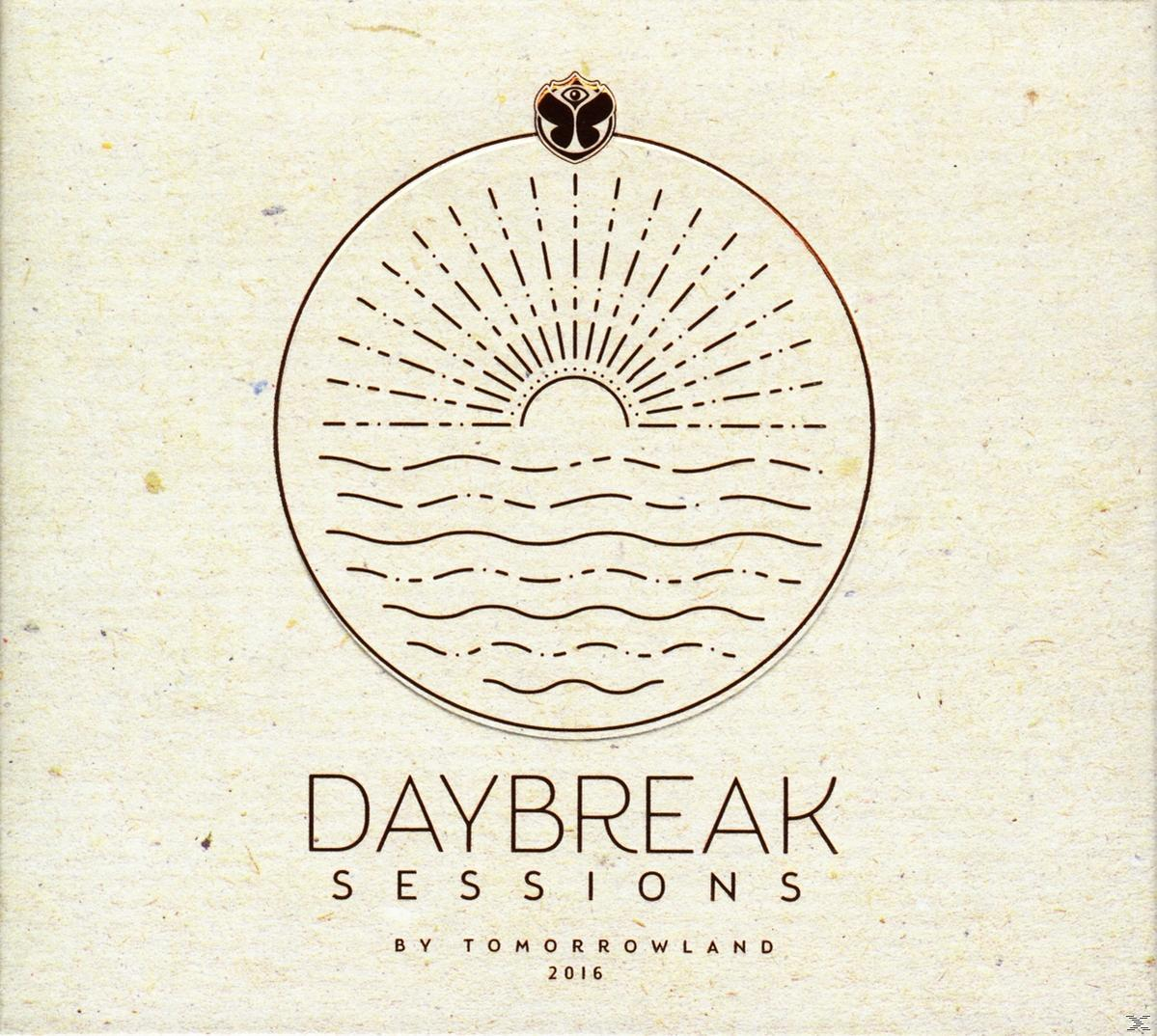 Albumhoes 'Daybreak Sessions' met een zonsopgang boven water en het Tomorrowland-logo.