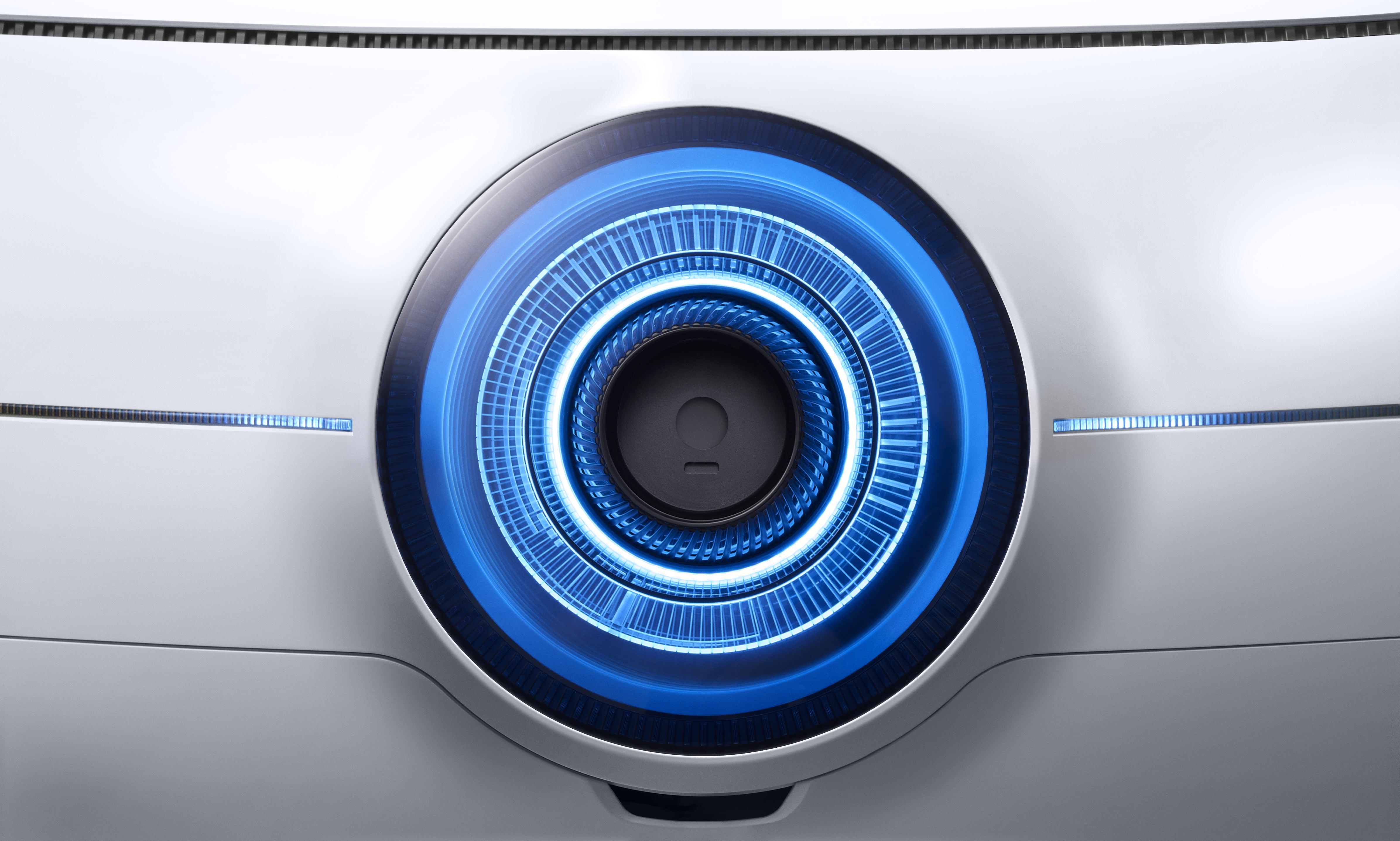 Weiße Monitorrückseite mit blauem Lichtring und Design.