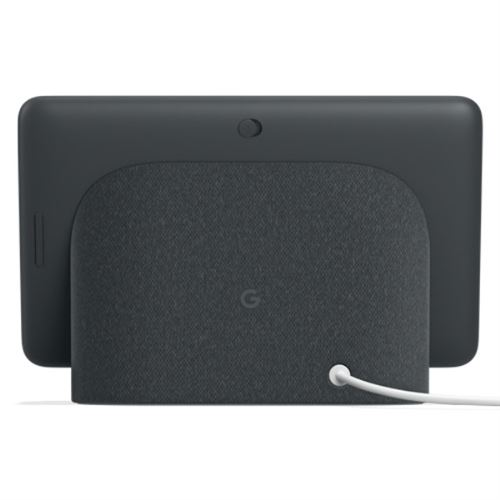 Vista trasera de un Google Nest Hub, con una pantalla negra y una base de tela gris, sobre una superficie blanca.