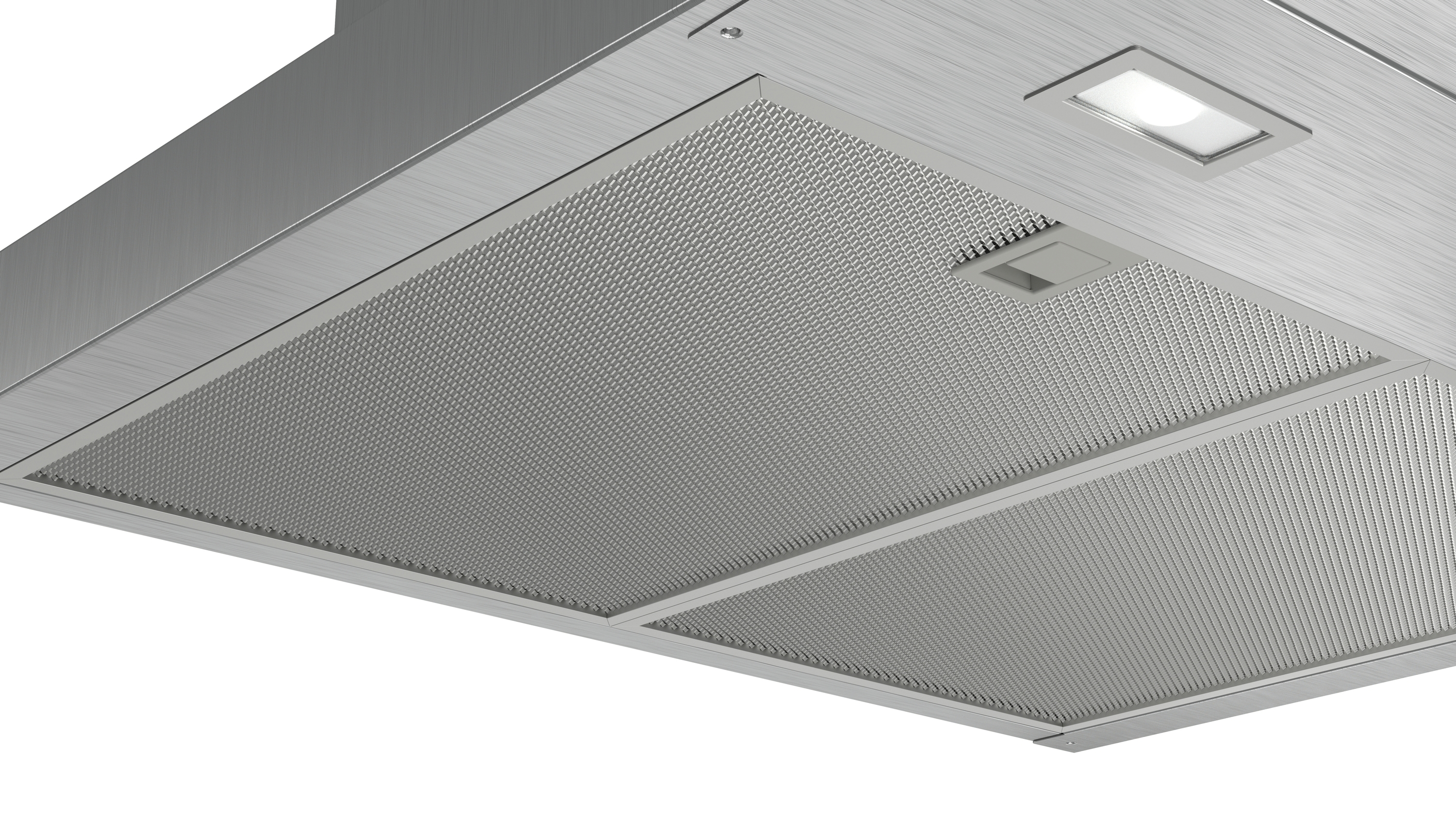 Close-up of a silver range hood with a mesh filter and a light.