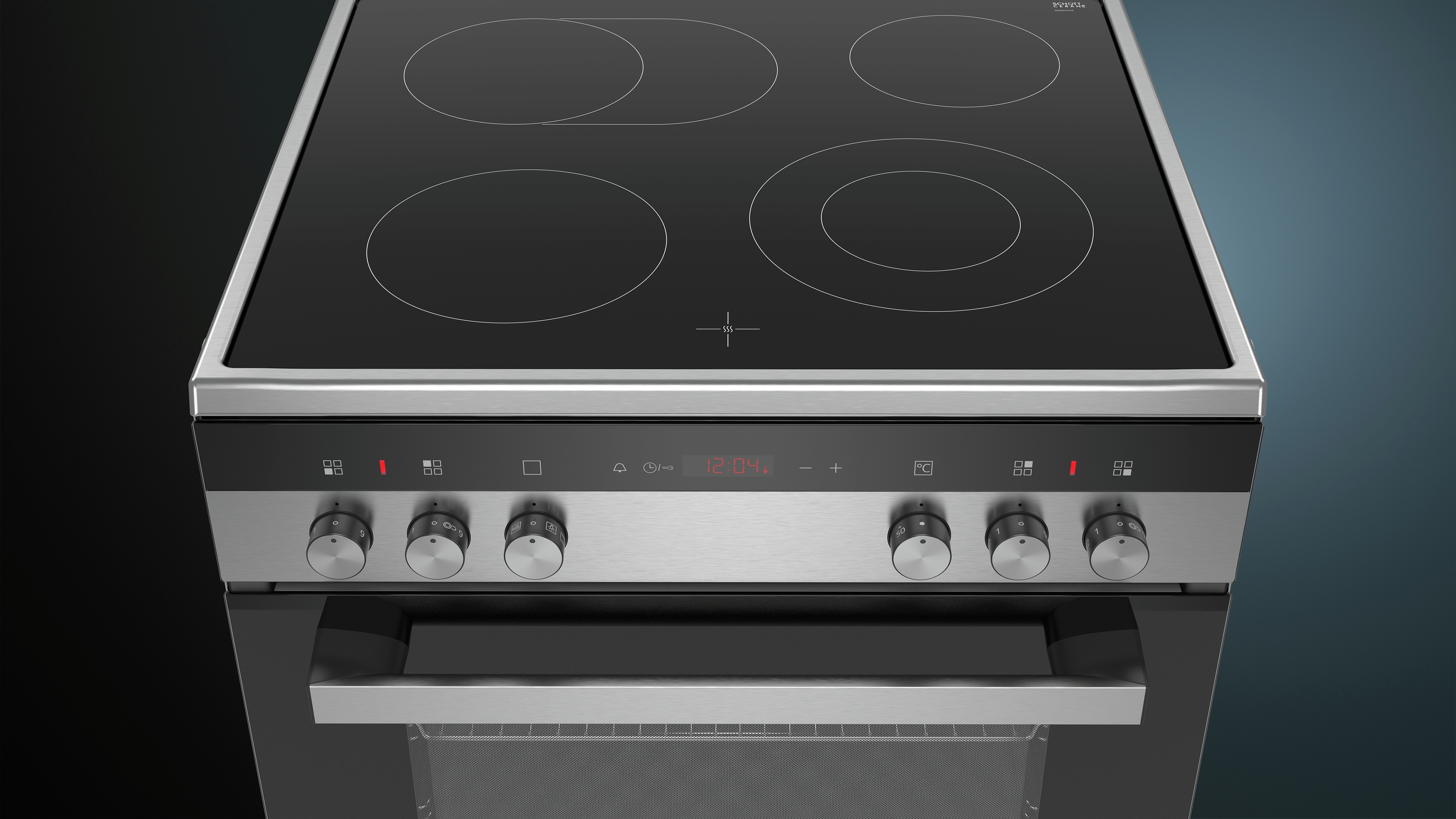 Een roestvrijstalen kookplaat met vier cirkelvormige verwarmingselementen. Knoppen en een ovendeur zijn zichtbaar.
