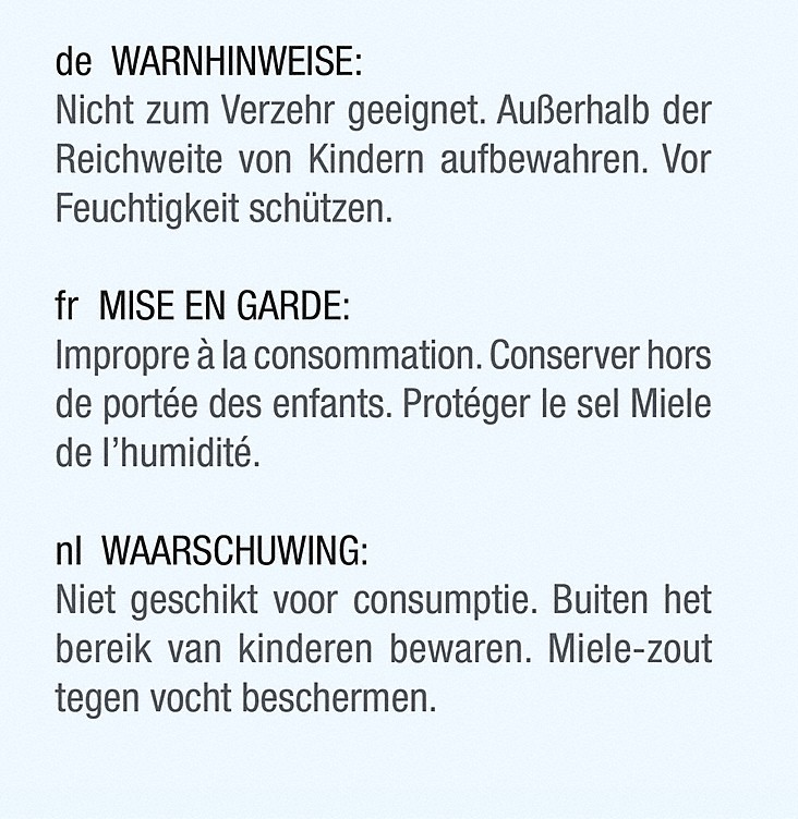 Waarschuwingslabels in het Duits, Frans en Nederlands, met instructies.