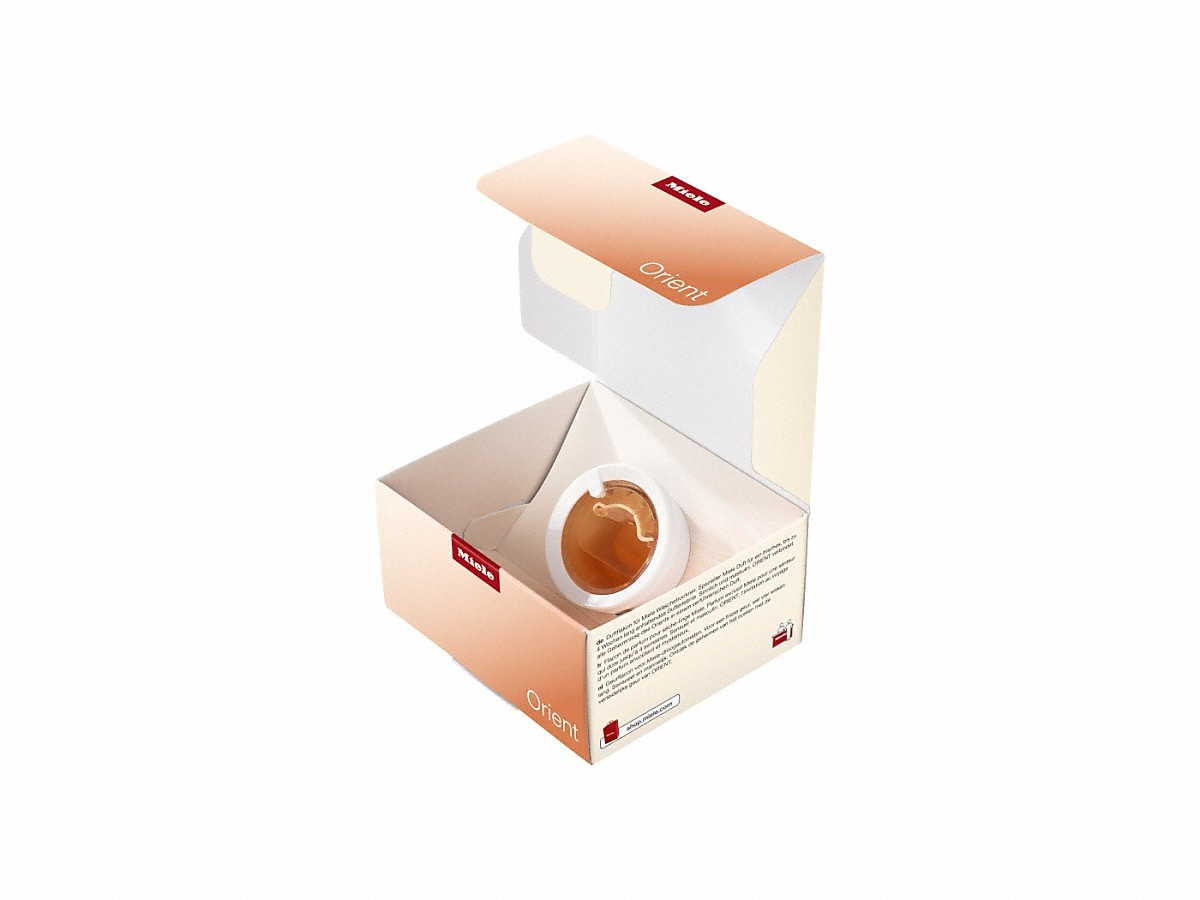 Miele coffee capsule box, open, with a capsule inside.