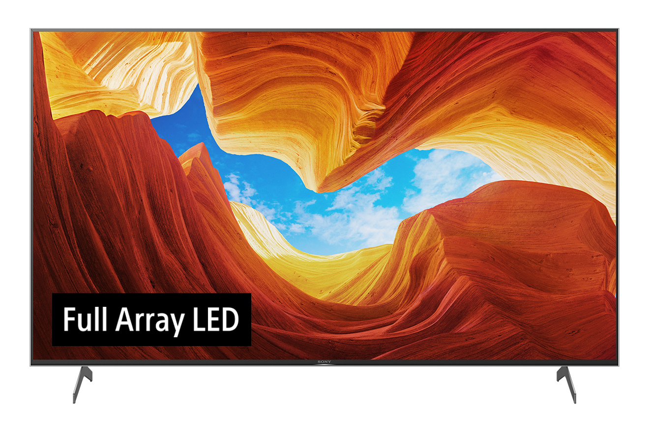 Ein großer Fernsehbildschirm zeigt eine Schluchtenlandschaft mit blauem Himmel und dem Text "Full Array LED".