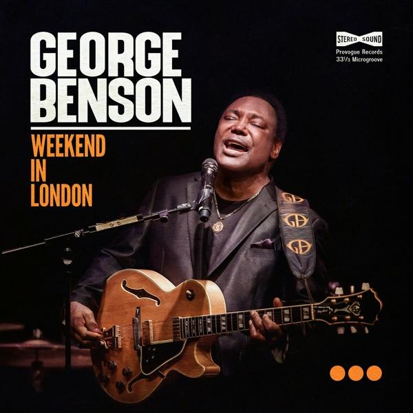 Albumcover von George Benson, der Gitarre spielt und singt, mit schwarzem Hintergrund.