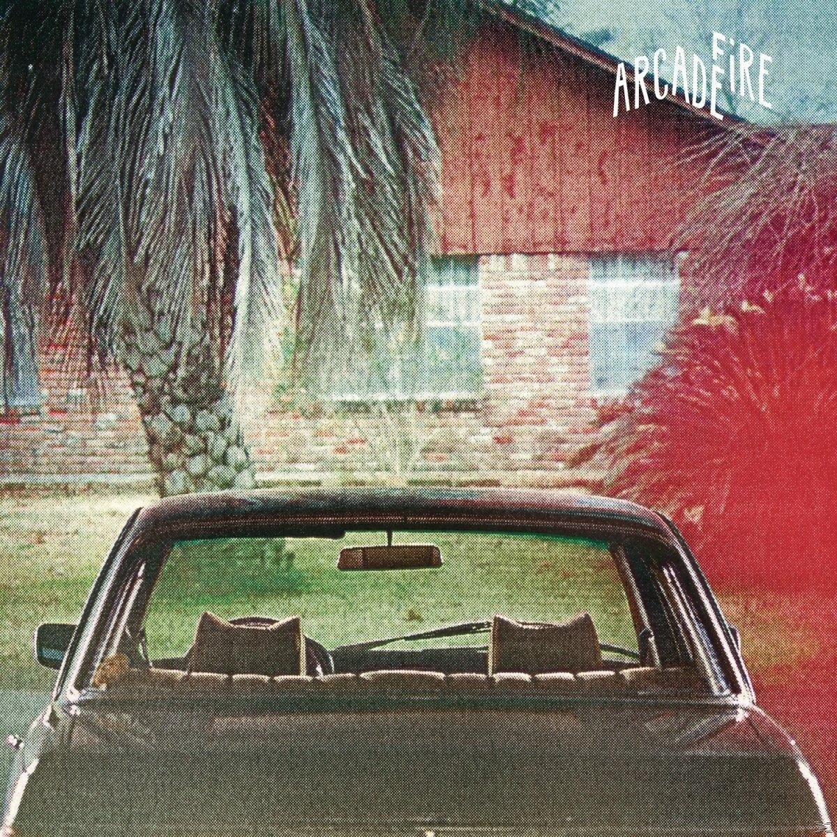 Innenansicht eines Autos. Palmen und ein Haus im Hintergrund. Arcade Fire Text.