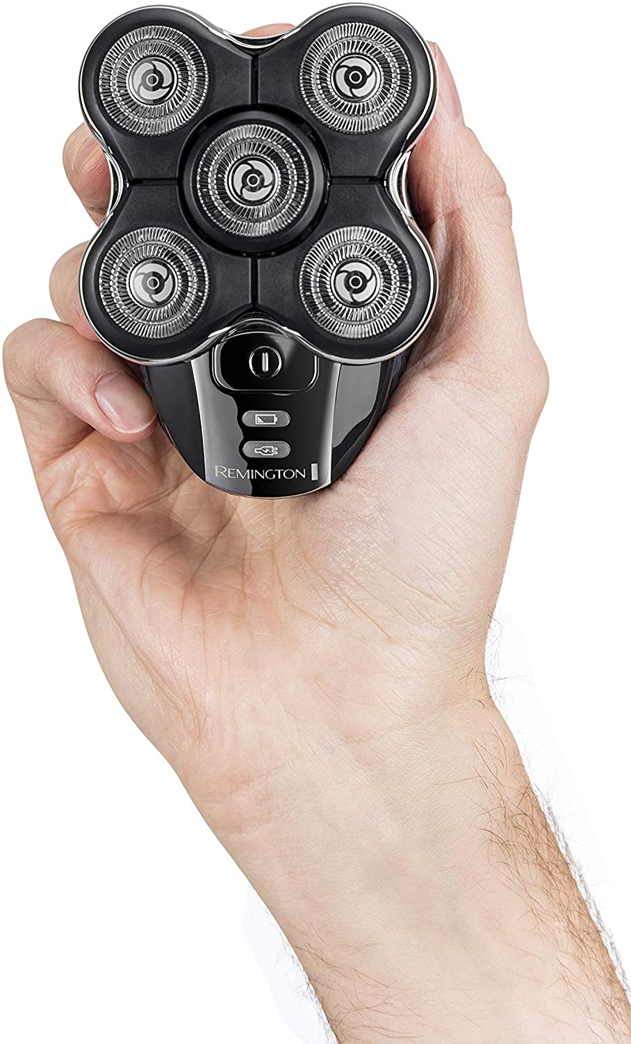 Mano sosteniendo una afeitadora rotativa Remington negra y plateada.