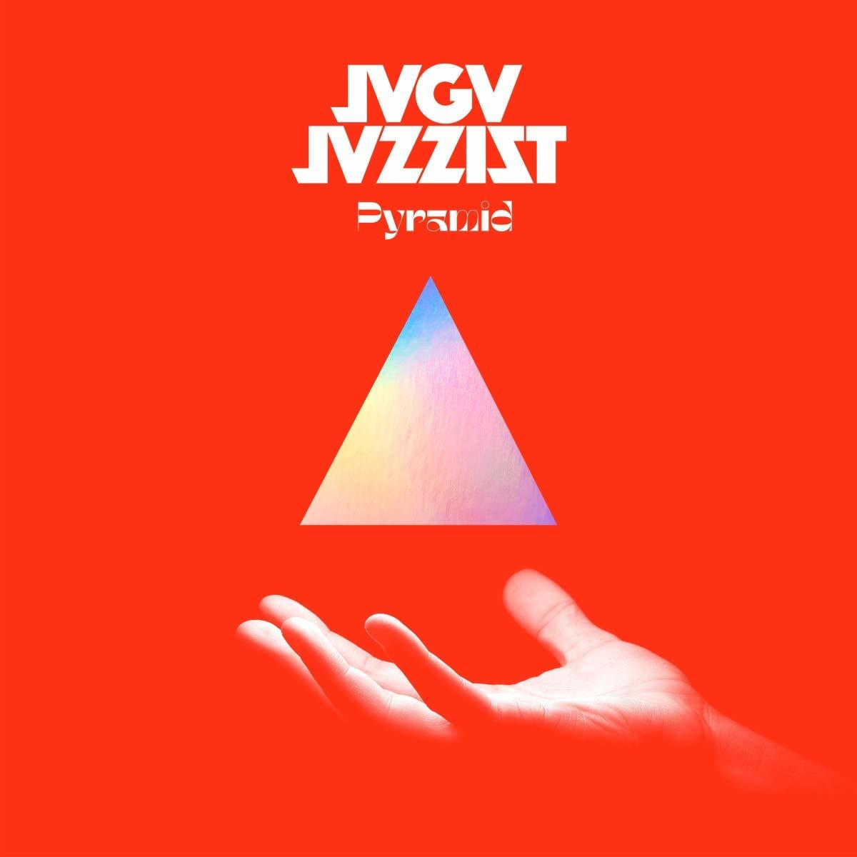 Pochette d'album : Une main touchant un prisme triangulaire sur fond rouge.