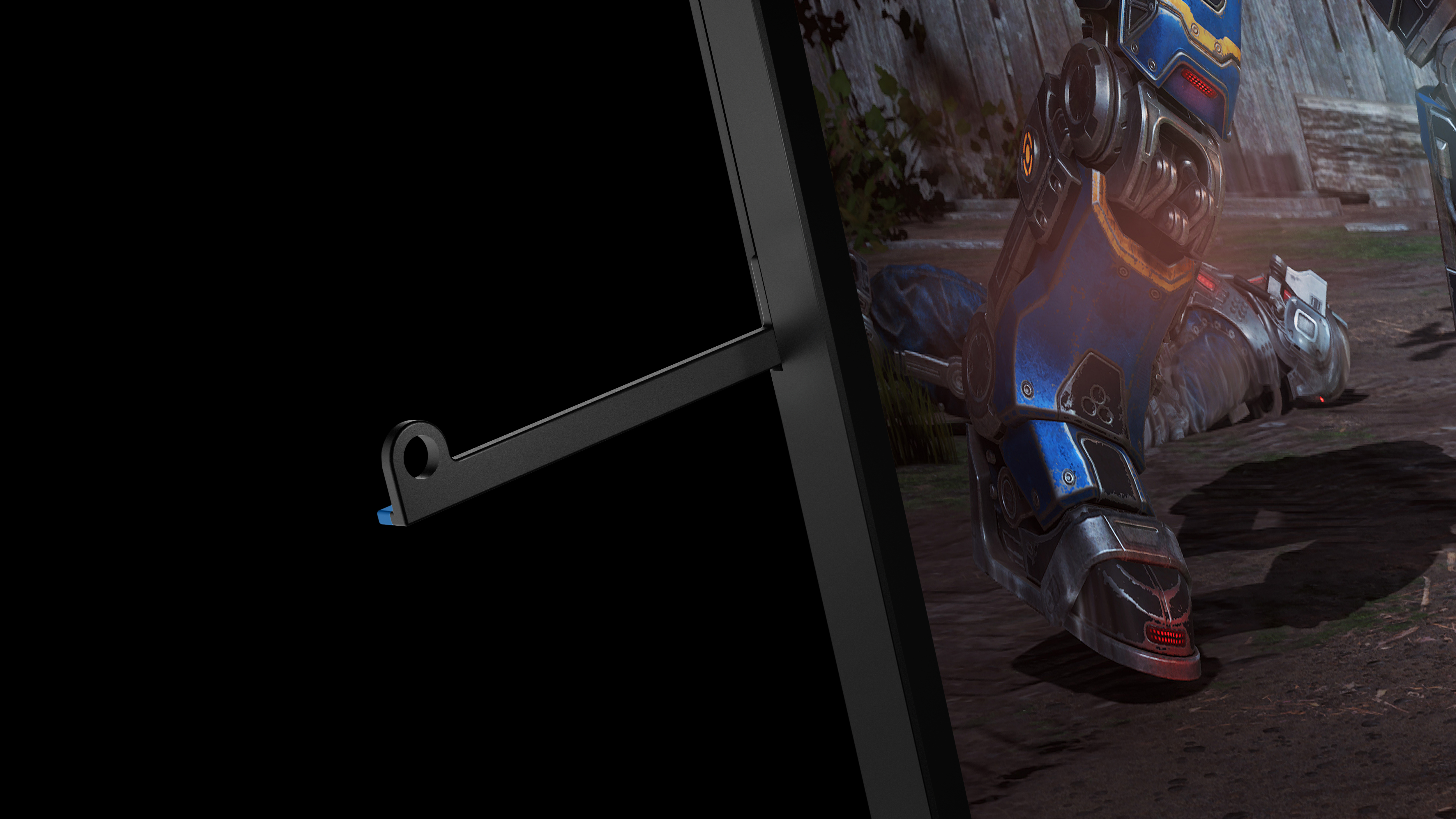 Ein Bein eines Gaming-Monitors und ein Bein eines Soldaten am Boden.
