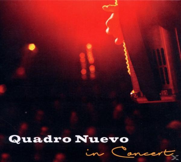 Albumcover: Quadro Nuevo in Concert, rote Bühnenbeleuchtung, dunkler Hintergrund.